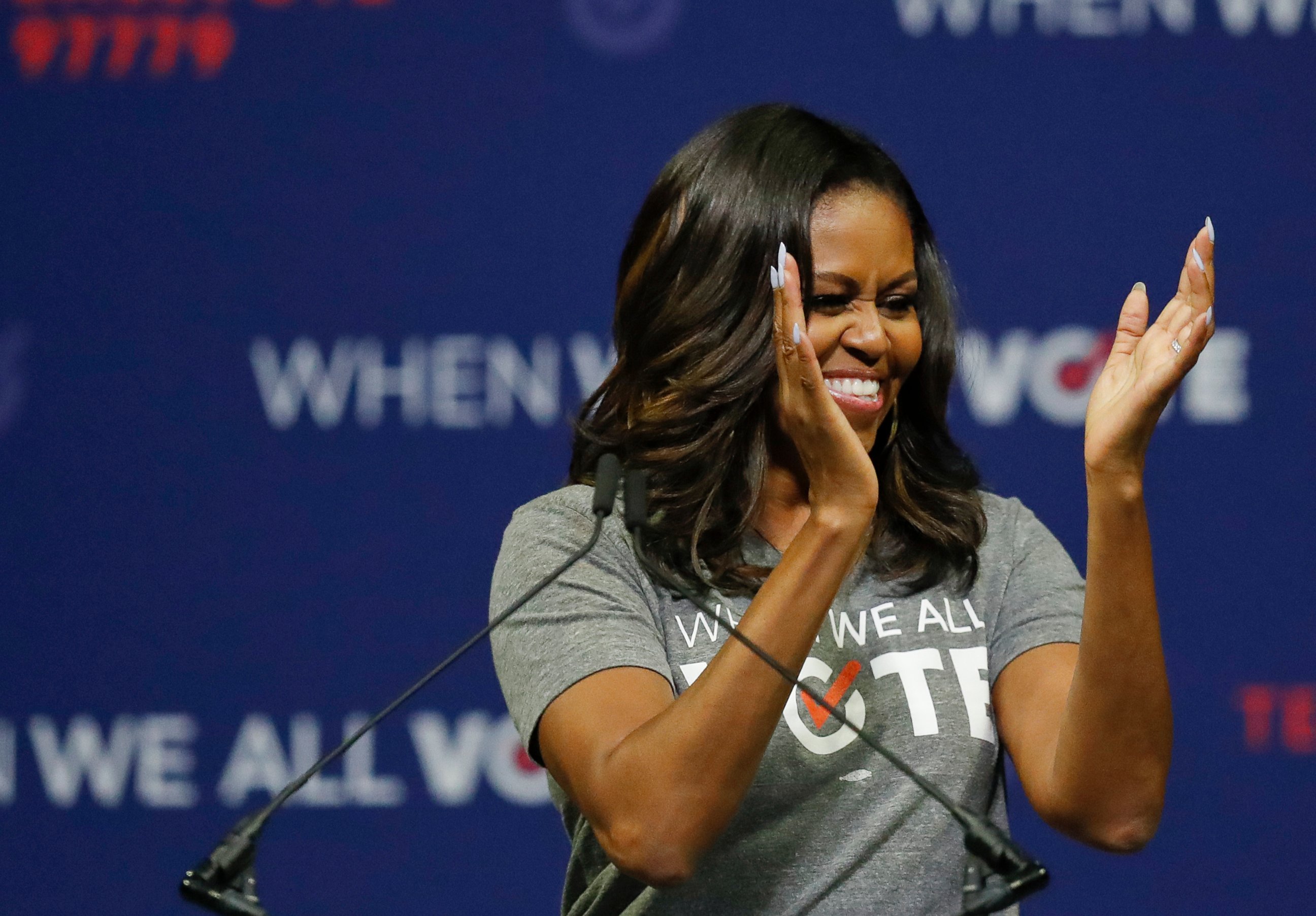 PHOTO: Former first lady Michelle Obama claps as she speaks at a rally to encourage voter registration on Friday, Sept. 28, 2018, in Coral Gables, Fla.