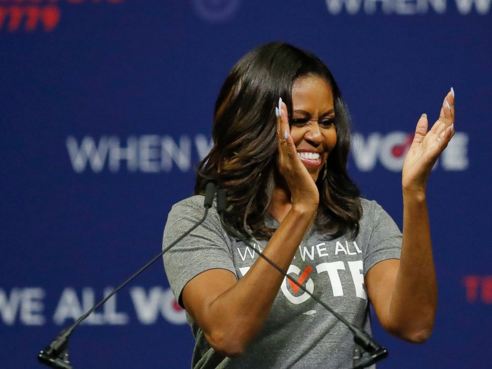 PHOTO: Former first lady Michelle Obama claps as she speaks at a rally to encourage voter registration on Friday, Sept. 28, 2018, in Coral Gables, Fla.