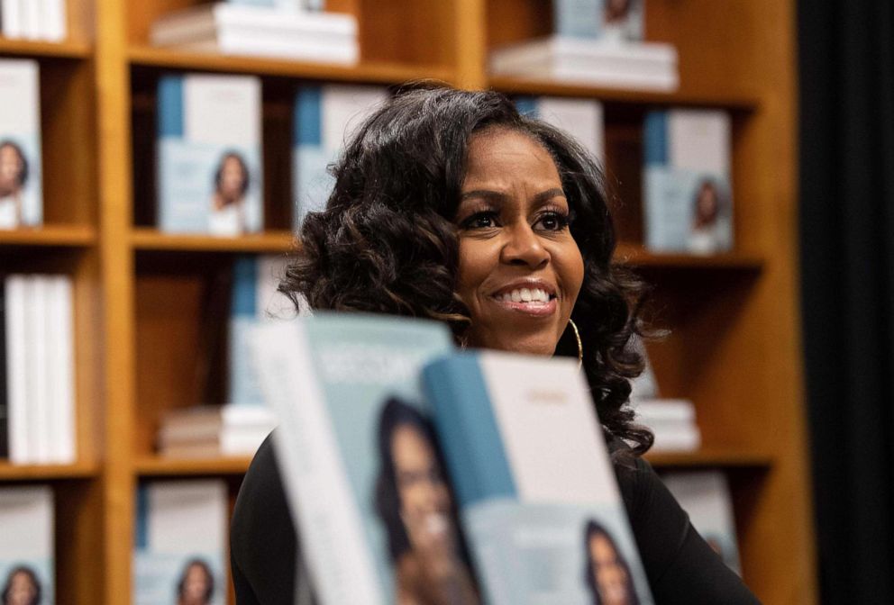 PHOTO: In this file photo taken on Nov. 18, 2019, former first lady Michelle Obama meets with fans during a book signing on the first anniversary of the launch of her memoir "Becoming" at the Politics and Prose bookstore in Washington. 