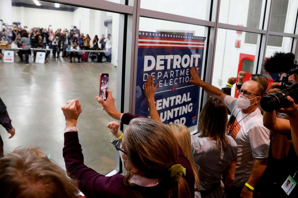 PHOTO: Supporters of President Donald Trump bang on the glass and chant slogans outside the room where absentee ballots for the 2020 general election are being counted at TCF Center on Nov. 4, 2020, in Detroit, Mich.