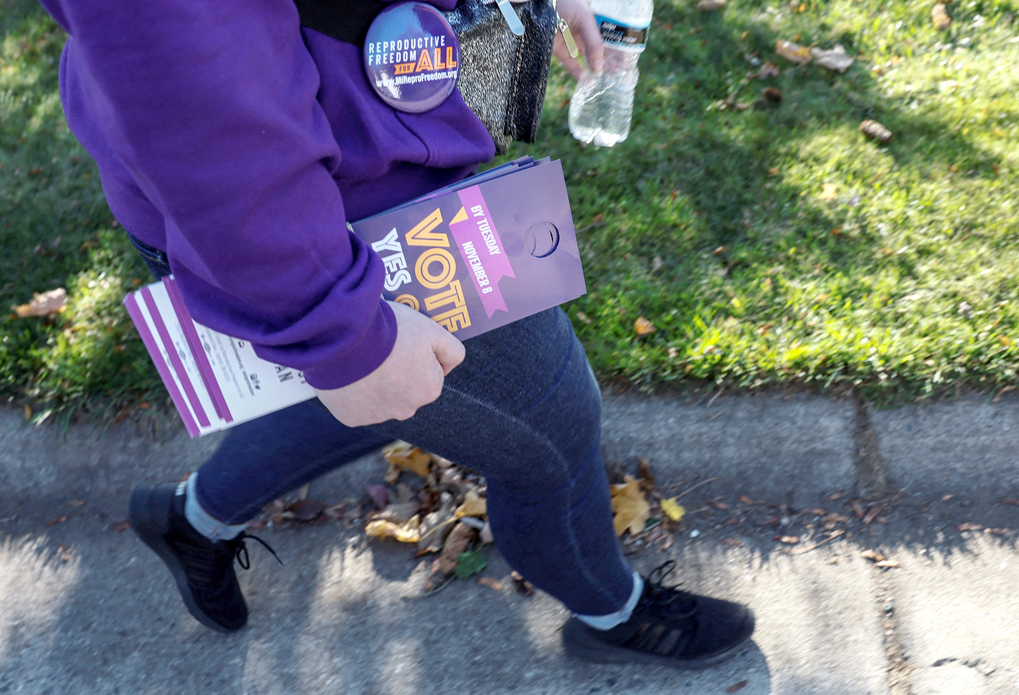 PHOTO: A digital media manager for Reproductive Freedom for All, canvasses a neighborhood in support of Proposal 3, a ballot measure that would codify the right to an abortion, one day before the midterm election in Dewitt, Mich., Nov. 7, 2022. 