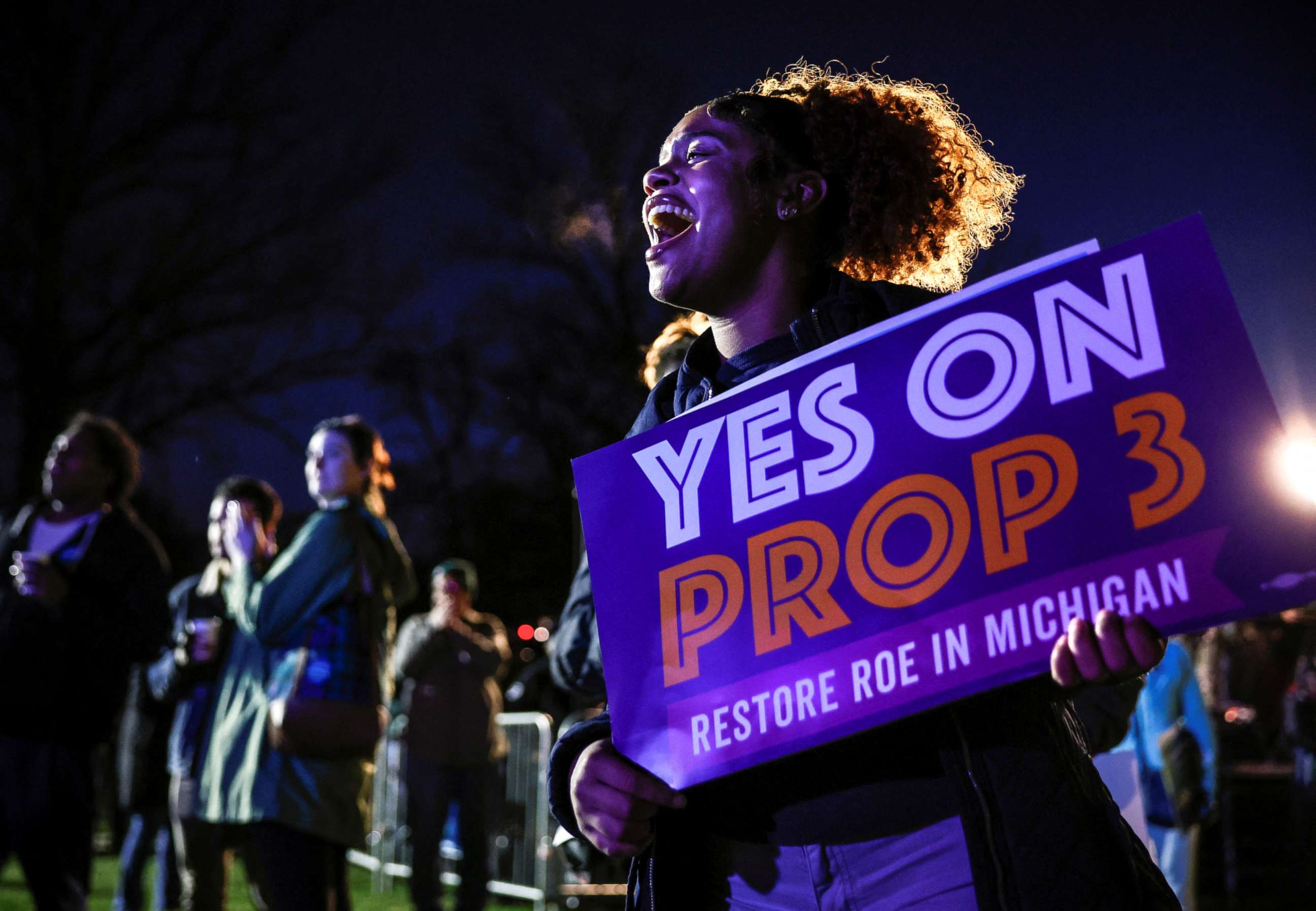 PHOTO: Jaelynn Smith, a freshman at Michigan State University, holds a sign in support of Proposal 3, a ballot measure which would codify abortion rights, during a 'get out the vote' rally at MSU, in East Lansing, Mich., Nov. 7, 2022.