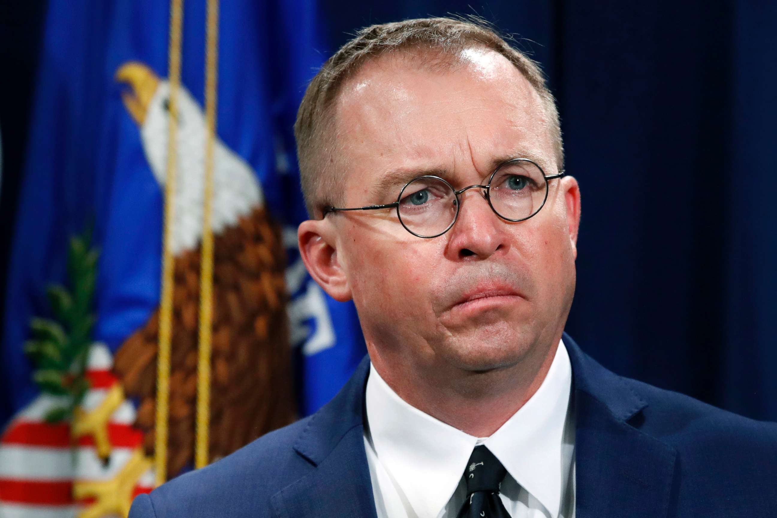 PHOTO: Mick Mulvaney, acting director of the Consumer Financial Protection Bureau (CFPB), and Director of the Office of Management, listens during a news conference at the Department of Justice in Washington, July 11, 2018.