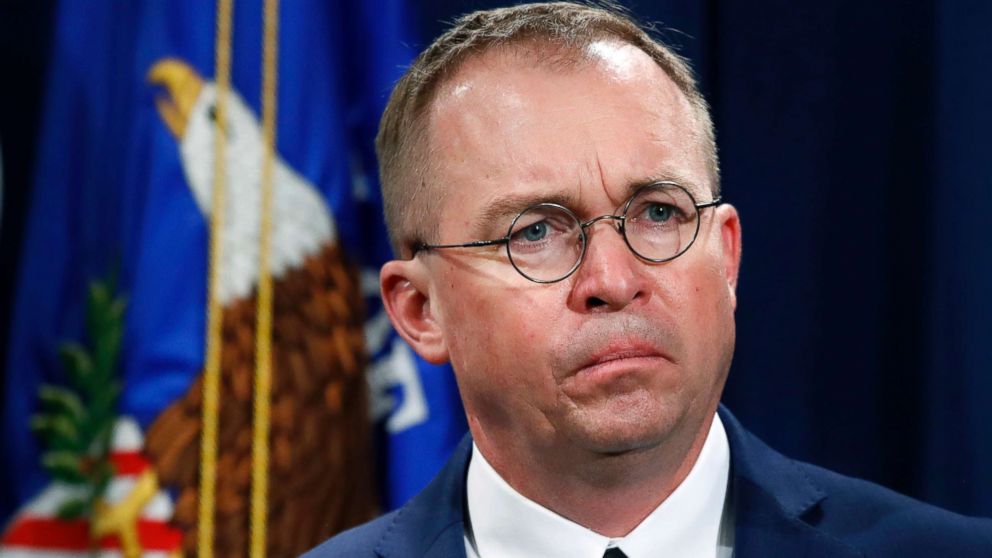 PHOTO: Mick Mulvaney, acting director of the Consumer Financial Protection Bureau (CFPB), and Director of the Office of Management, listens during a news conference at the Department of Justice in Washington, July 11, 2018.