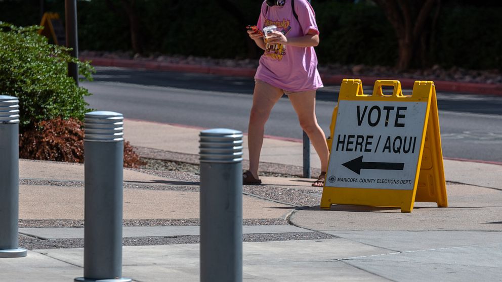 PHOTO: A voter arrives to a polling location at Arizona State University in Tempe, Ariz., Aug. 2, 2022. 