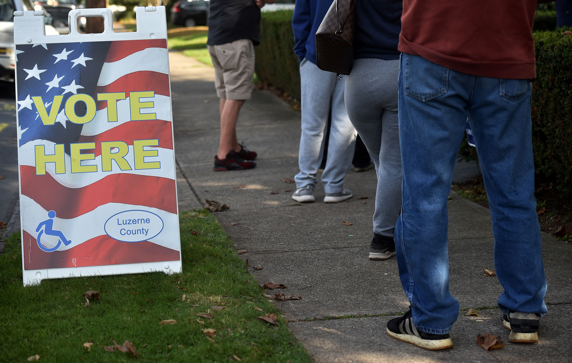 PHOTO: Voters seen line up to vote at St Aloyscious Church in Wilkes-Barre, Pa., Nov. 3, 2020.
