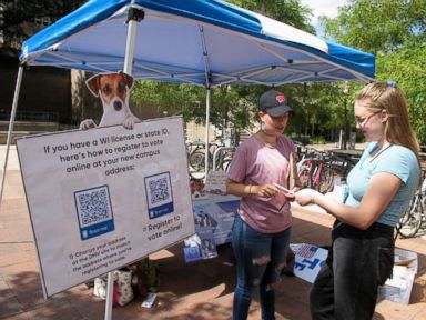 PHOTO: NextGen America campus organizer Simone Williams, left, talks with Grace Austin, a junior at the University of Wisconsin, about how to register to vote in Madison, Wis., Aug. 30, 2018.