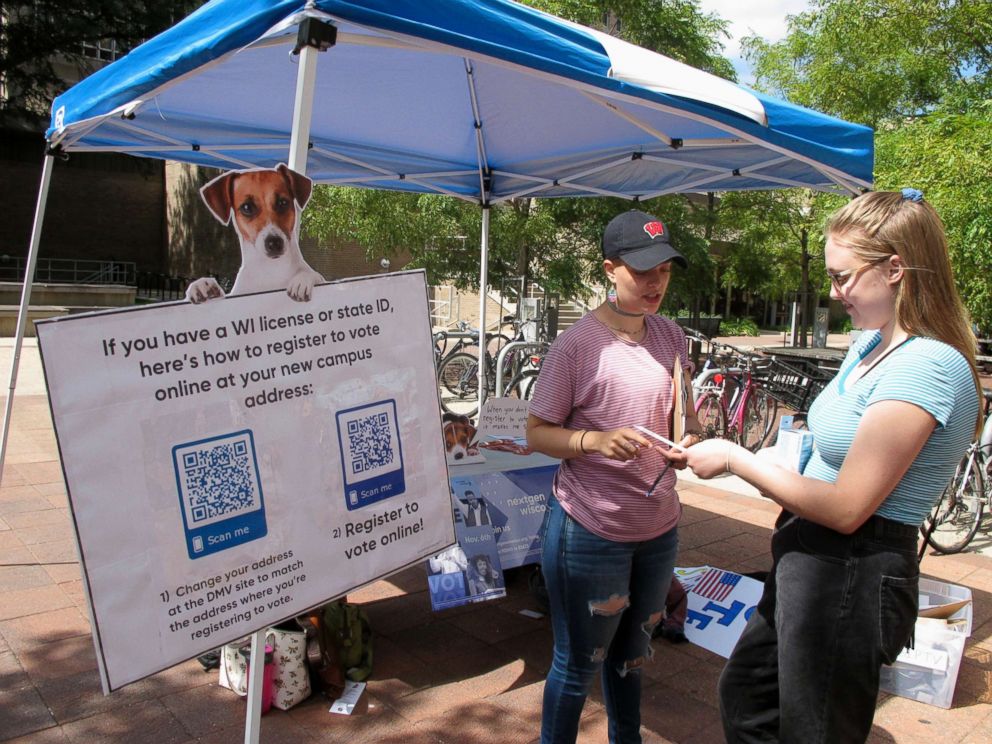 PHOTO: NextGen America campus organizer Simone Williams, left, talks with Grace Austin, a junior at the University of Wisconsin, about how to register to vote in Madison, Wis., Aug. 30, 2018.