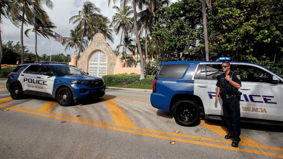 PHOTO: Authorities stand outside Mar-a-Lago, former president Donald Trump's residence, amid reports of the FBI executing a search warrant as part of a document investigation, in Palm Beach, Fla., August 9, 2022.