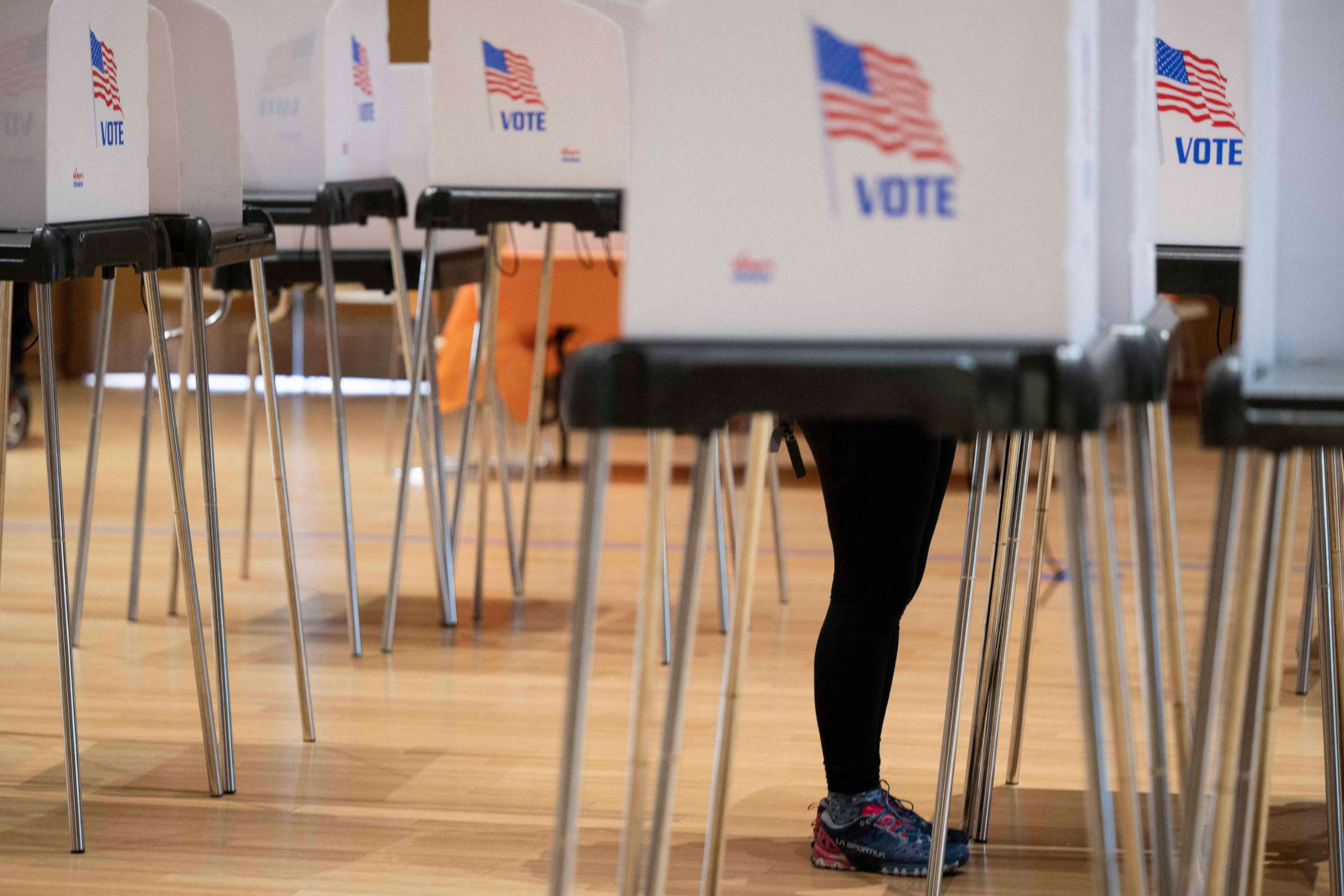 PHOTO: A voter marks her ballot during early voting for the midterm elections, Oct. 28, 2022, in Silver Spring, Md.