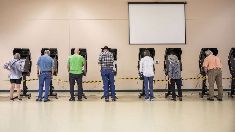 PHOTO: In this Aug. 16, 2022, file photo, voters cast ballots at a polling location at North Christian Church in Cheyenne, Wyoming.