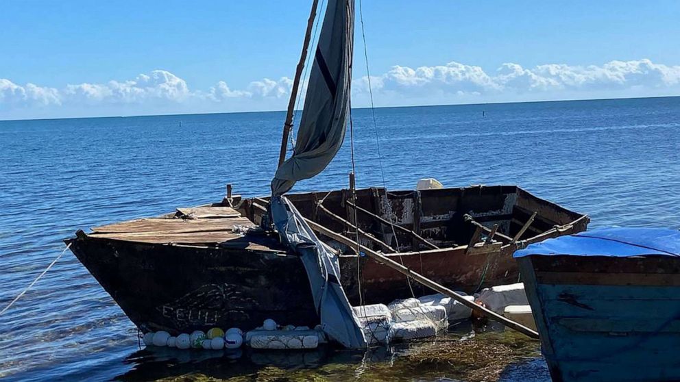 PHOTO: A steel-hulled, makeshift migrant sailboat is grounded near the mangroves of Harry Harris Park, Jan. 10, 2023, in the Upper Keys area of Tavernier, Fla.