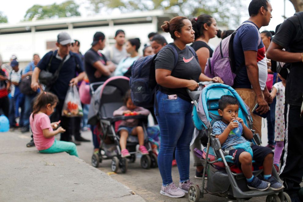 PHOTO: People belonging to a caravan of migrants from El Salvador form a line at a border crossing point en route to the United States, in La Hachadura, El Salvador, Oct. 31, 2018.