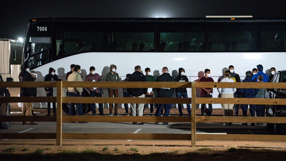 PHOTO: Migrant children and teenagers from the southern border of the United State are processed after entering the site of a temporary holding facility Sunday, March 14, 2021, south of Midland, Texas.