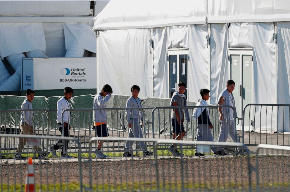 PHOTO: Children line up to enter a tent at the Homestead Temporary Shelter for Unaccompanied Children in Homestead, Fla., Feb. 19, 2019.