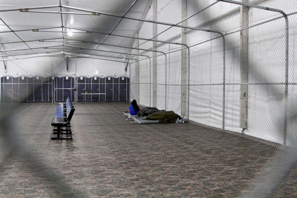 PHOTO: Migrants are detained in a tented, air-conditioned cage at a Border Patrol detention facility in Tornillo, Texas, Aug. 15, 2019.