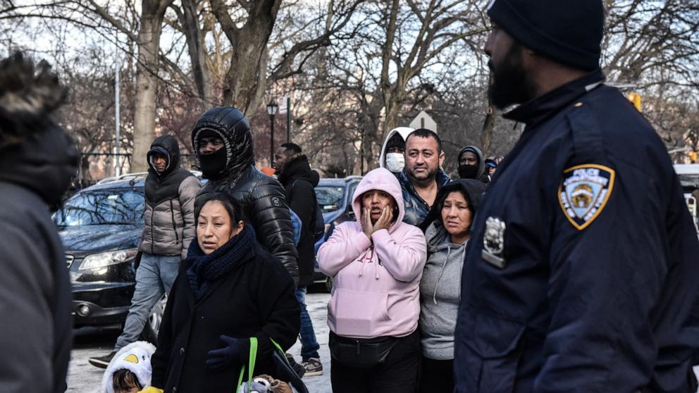 PHOTO: Homeless migrants wait in Tompkins Square Park as food and clothing are distributed, Jan. 20, 2024, in New York.