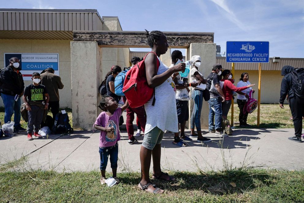 PHOTO:  Migrants, many from Haiti, wait to board a bus to Houston at a humanitarian center after they were released from United States Border Patrol upon crossing the Rio Grande and turning themselves in seeking asylum, Sept. 22, 2021, in Del Rio, Texas.