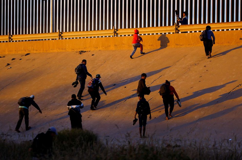 PHOTO: Asylum-seeking migrants emerge after crossing the Rio Bravo river to turn themselves in to U.S Border Patrol agents to request asylum in El Paso, Texas, Nov. 22, 2022.
