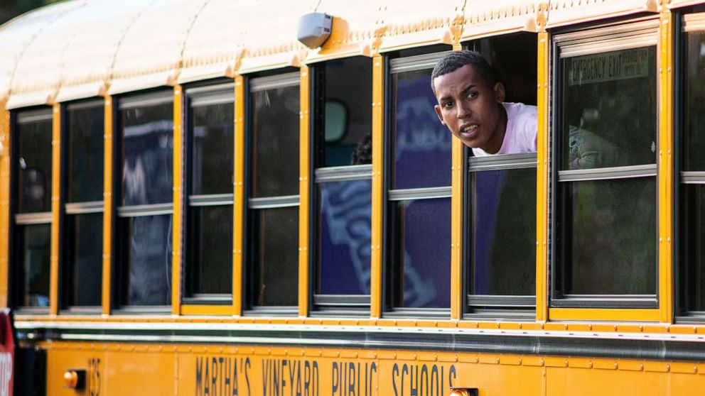 PHOTO: A migrant looks out of the window of a school bus being used to transport a group who arrived from Florida in Martha's Vineyard, Mass., Sept. 14, 2022.