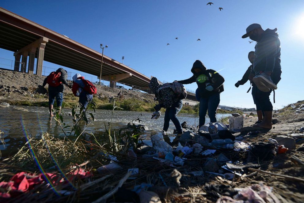 PHOTO: Migrants cross the US-Mexico border from Ciudad Juarez, Mexico, on Dec. 14, 2022.