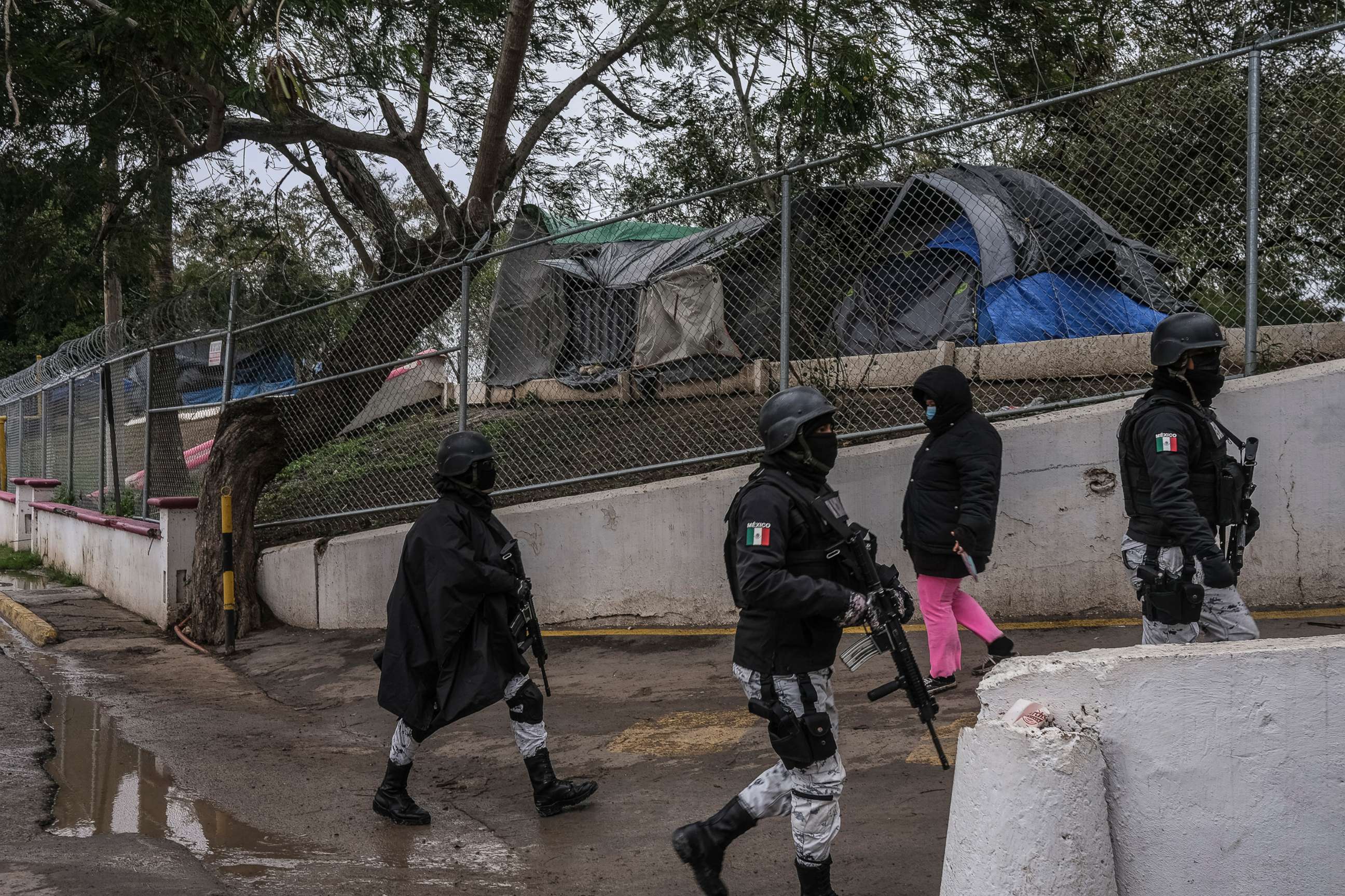 PHOTO: Mexican National Guards patrol outside the make-shift camp for asylum seekers, Feb. 14, 2021, in Matamoros, Mexico. 