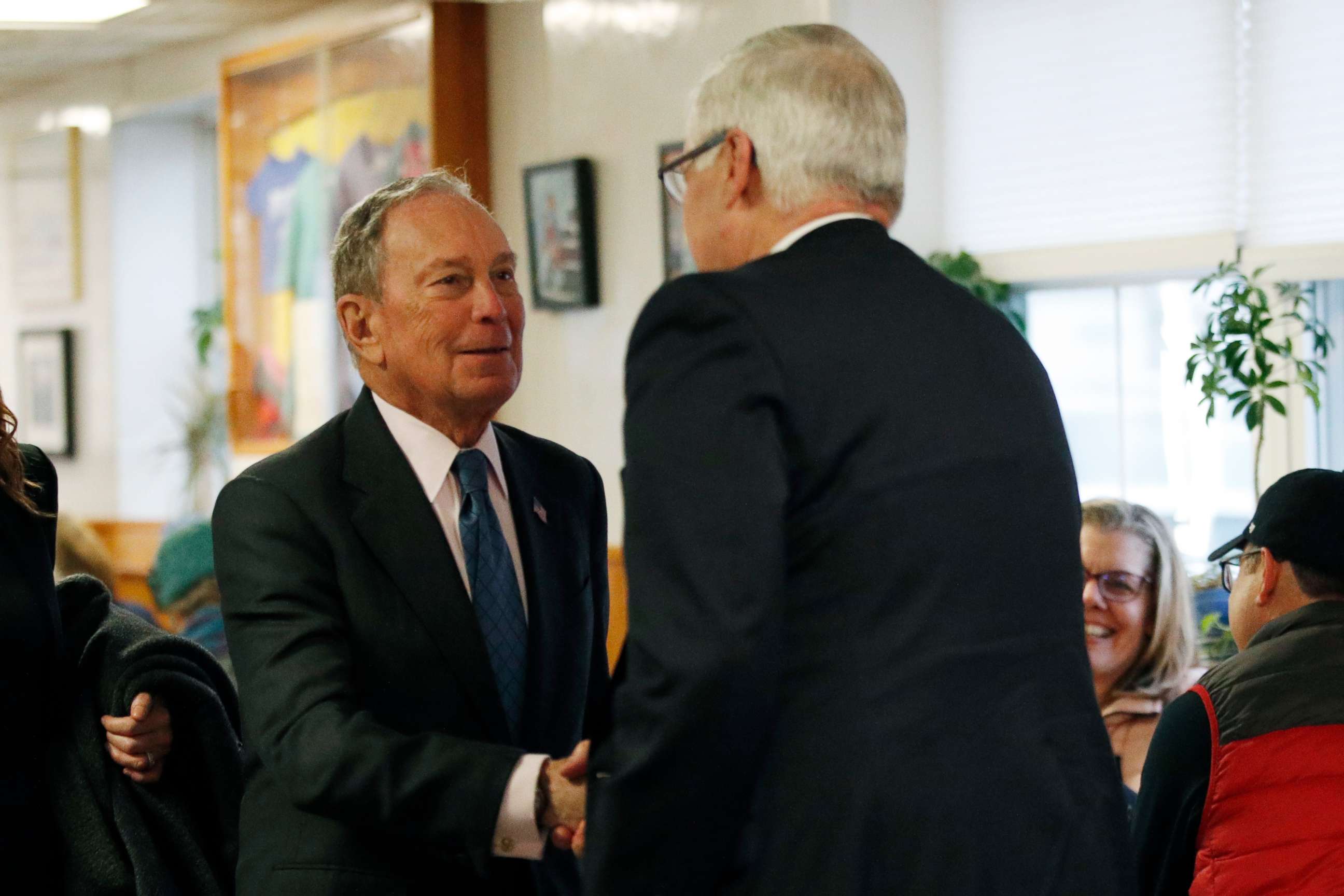 PHOTO: Democratic presidential candidate and former New York City Mayor Michael Bloomberg, left, is greeted by former U.S. Rep. Mike Michaud at Becky's Diner, Monday, Jan. 27, 2020, in Portland, Maine.