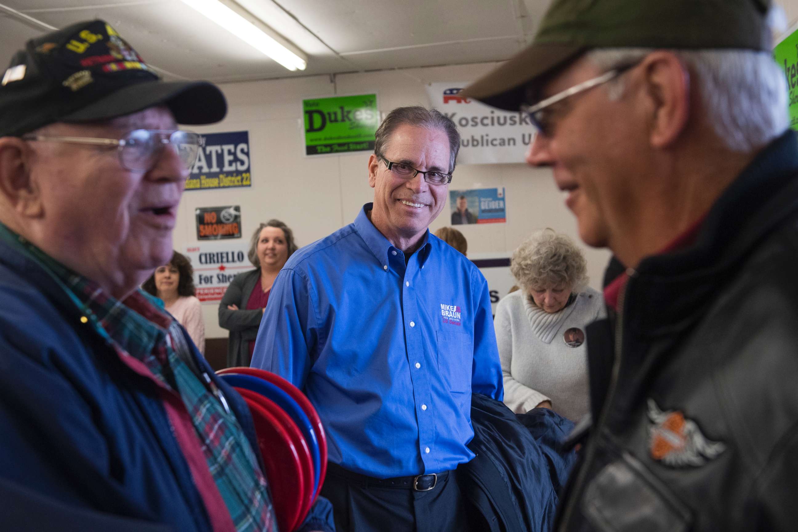 PHOTO: Mike Braun, center, candidate for the Republican nomination for Senate in Indiana, attends the Kosciusko County Republican Fish Fry in Warsaw, Ind., April 4, 2018.