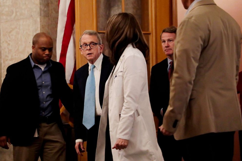PHOTO: Ohio Gov. Mike DeWine walks toward the State Room before their update on the state's response to the ongoing COVID-19 pandemic at the Ohio Statehouse in Columbus, Ohio, March 30, 2020.