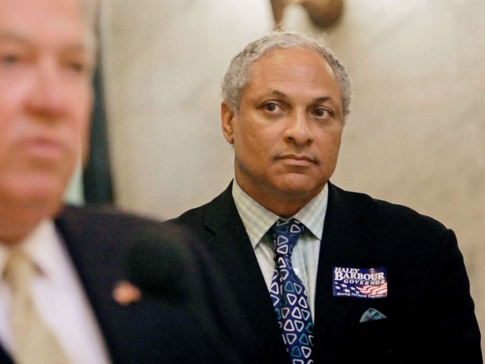 PHOTO: Mike Espy listens to Gov. Haley Barbour during a news conference, Wednesday, Oct. 17, 2007, at the Capitol in Jackson, Miss.