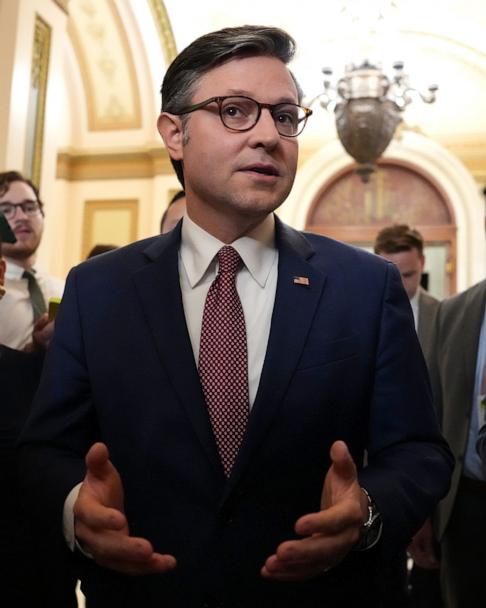 Speaker Mike Johnson speaks to reporters as he leaves the House Chamber at the U.S. Capitol, May 15, 2025 in Washington.