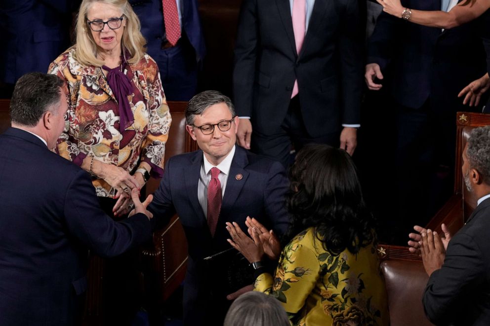 PHOTO: House speaker-elect Rep. Mike Johnson, R-La., is congratulated by fellow members after he was elected as the new House speaker, at the Capitol in Washington, Oct. 25, 2023.