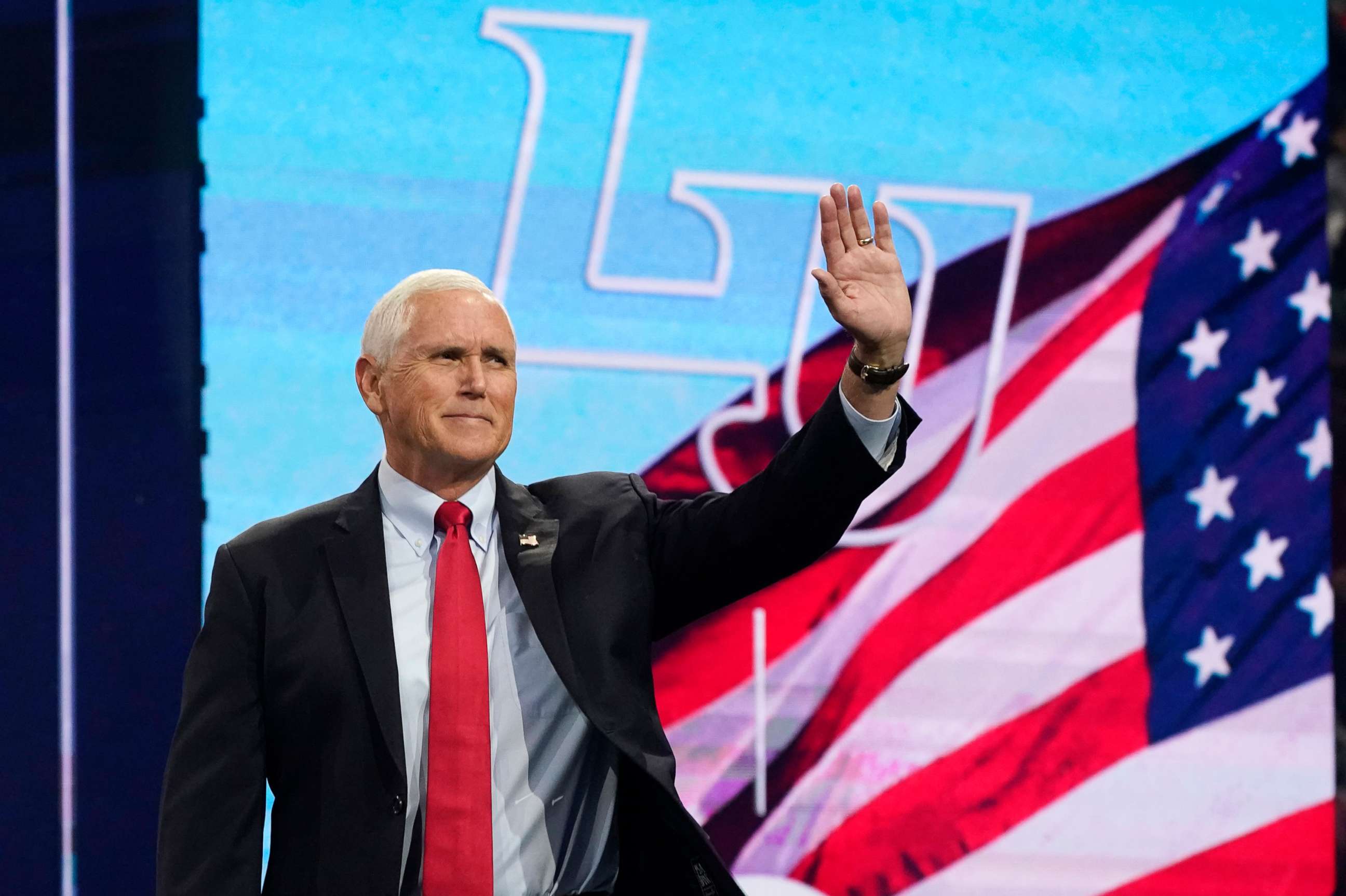 PHOTO: Former Vice President Mike Pence waves to the crowd as he prepares to addresses the convocation at Liberty University, on Sep. 14, 2022, in Lynchburg, Va.