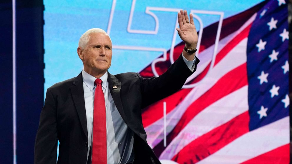 PHOTO: Former Vice President Mike Pence waves to the crowd as he prepares to addresses the convocation at Liberty University, on Sep. 14, 2022, in Lynchburg, Va.