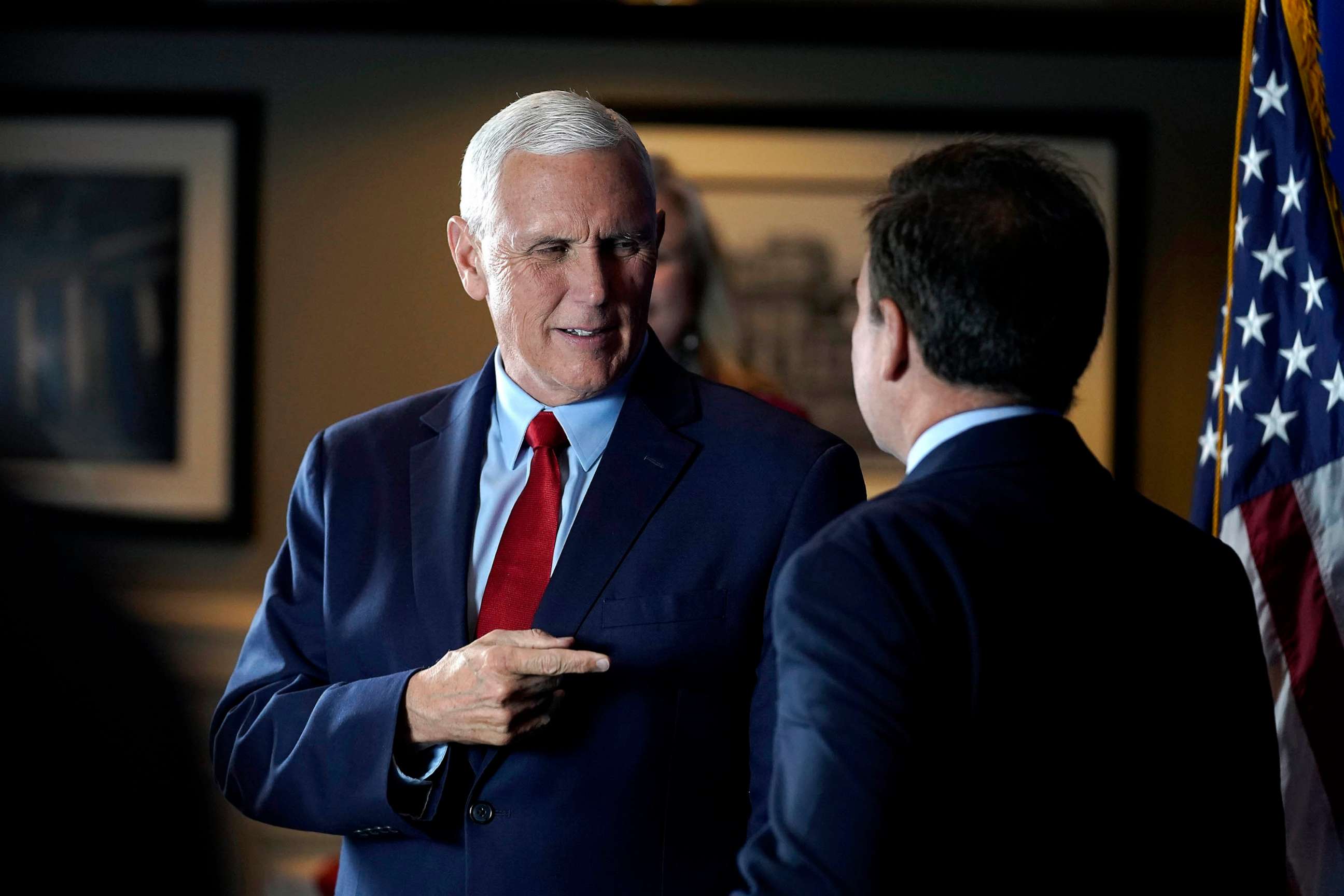 PHOTO: Former Vice President Mike Pence greets people while signing copies of his book "So Help Me God" before the start of a GOP fundraising dinner, March 16, 2023, in Keene, N.H.