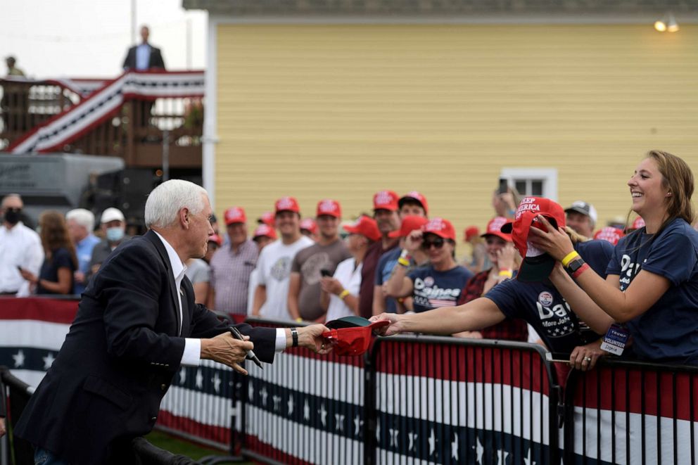 PHOTO: Vice President Mike Pence signs a hat for a supporter at a Republican campaign rally in Belgrade, Mont., on Monday, Sept. 14, 2020.