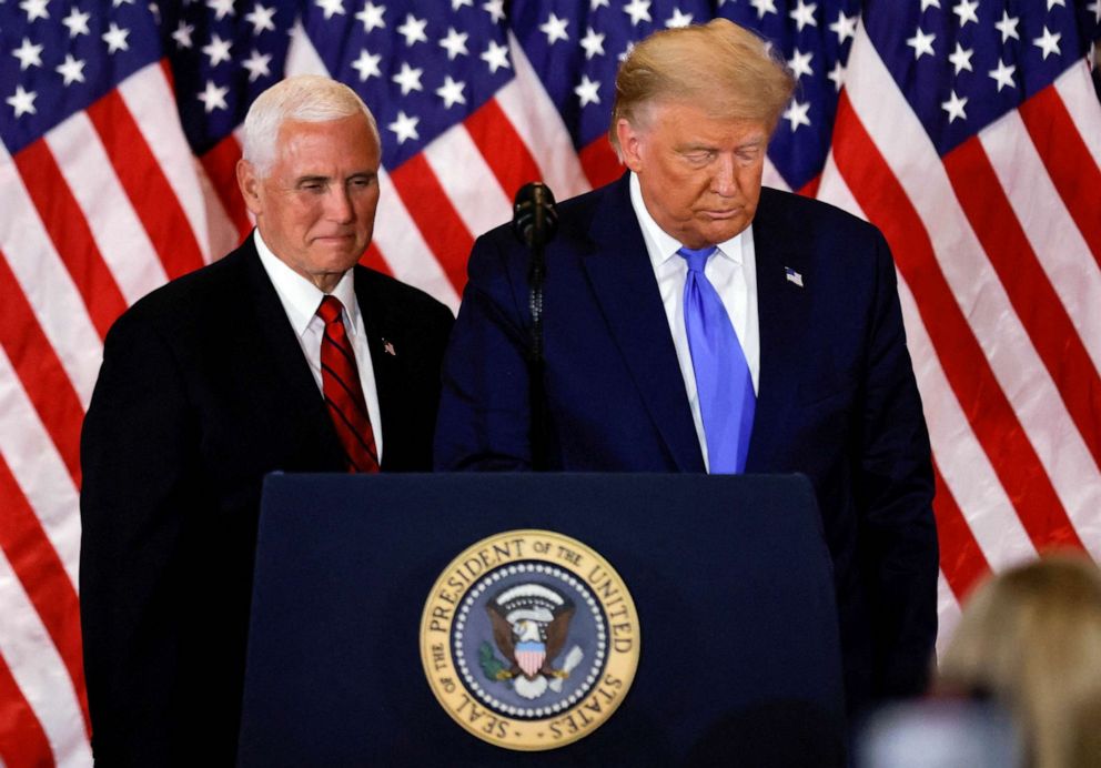 PHOTO: FILE - President Donald Trump and Vice President Mike Pence stand while making remarks about early results from the 2020 U.S. presidential election in the East Room of the White House in Washington, Nov. 4, 2020.