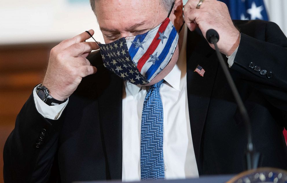 PHOTO: Secretary of State Mike Pompeo puts on his mask after speaking to the press prior to meeting with Kuwaiti Foreign Minister Sheikh Ahmad Nasser Al-Mohammad Al-Sabah at the State Department in Washington, Nov. 24, 2020.