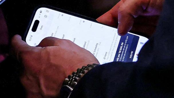 U.S. National Security Advisor Mike Waltz checks his mobile phone while attending a cabinet meeting held by President Donald Trump at the White House in Washington, April 30, 2025. 