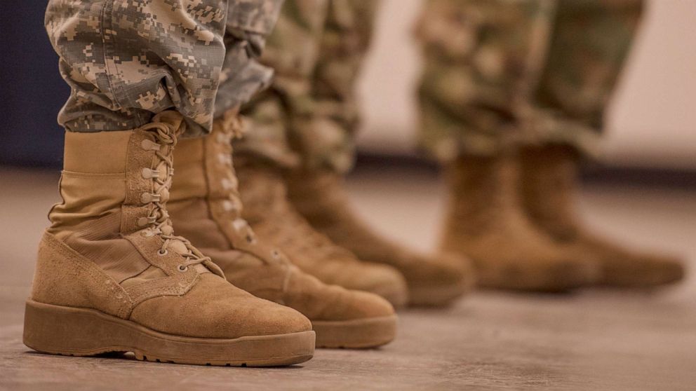 PHOTO: Boots soon to be on the ground: Three U.S. Army Reserve Soldiers wait to begin their deployment ceremony at the 335th Signal Command (Theater) headquarters, March 7, 2017.