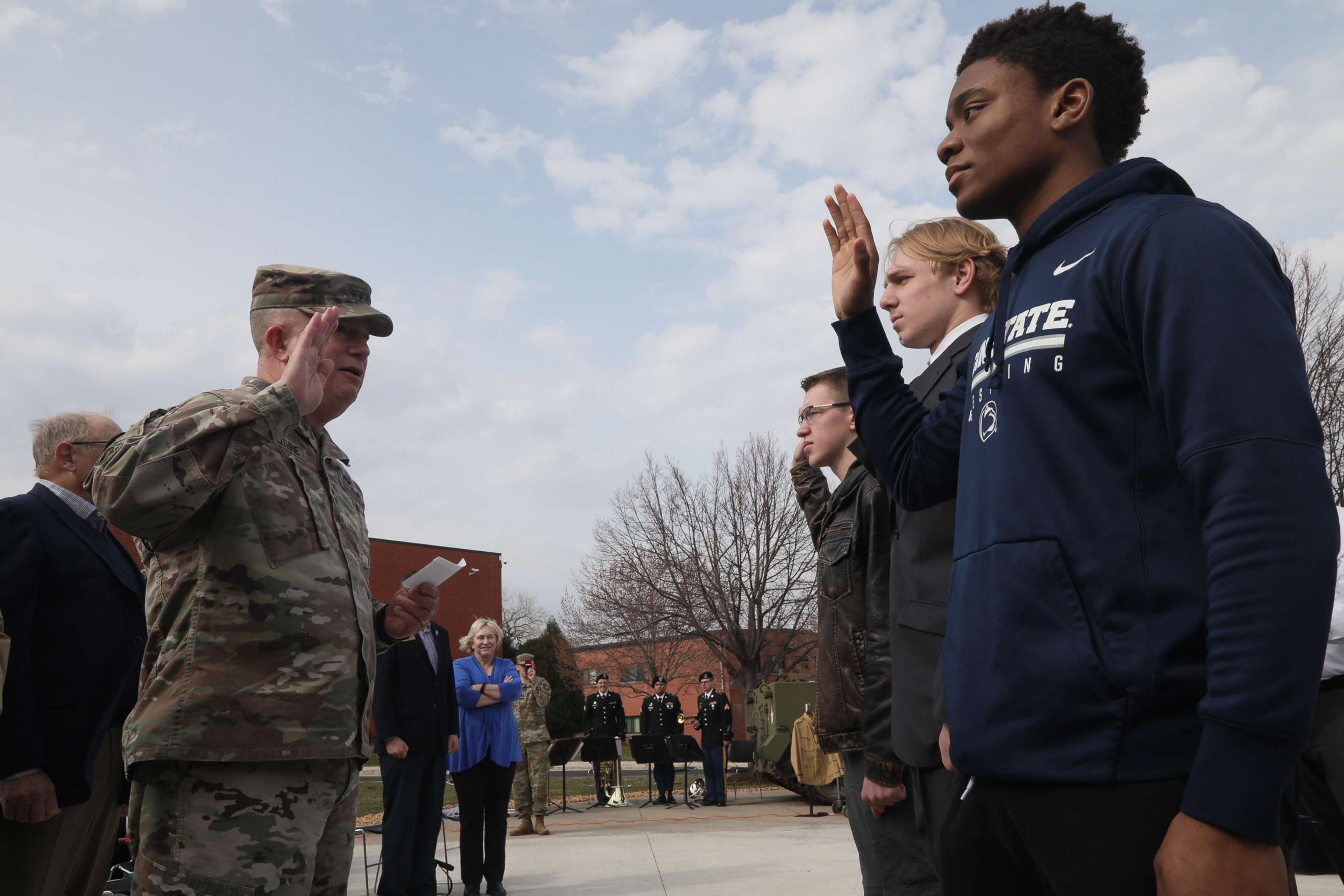 PHOTO: U.S. Army Reserve Maj. Gen. Darrell J. Guthrie administers the oath of enlistment to Future Soldiers, Ethan Ethan Fisher, center, Darrin Kuyper and Kenneth Stahl at Fort Snelling, Minn., April 29, 2022.