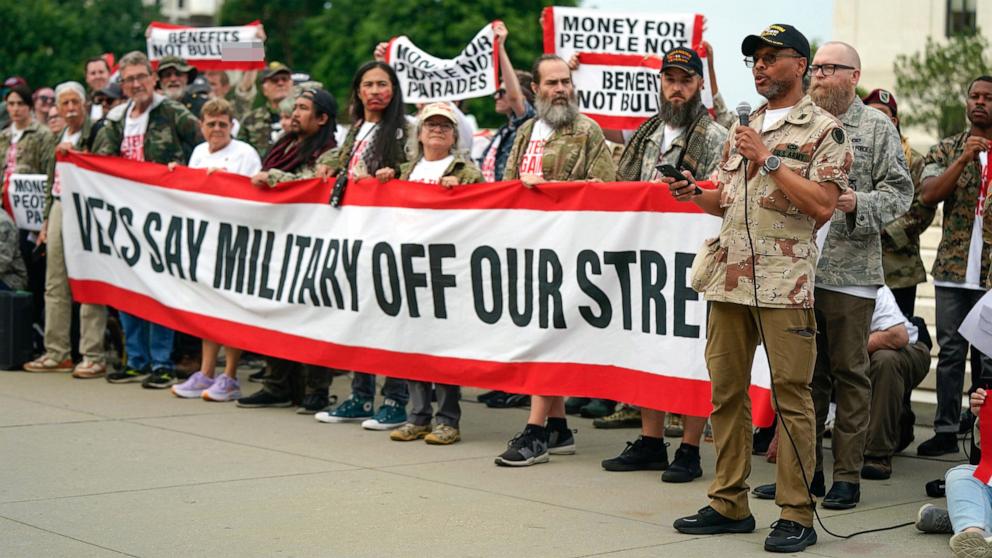 PHOTO: A demonstator speaks outside the U.S. Supreme Court during a protest of the upcoming parade for the Army's 250th anniversary, which falls on President Donald Trump's birthday, on June 13, 2025, in Washington, D.C.