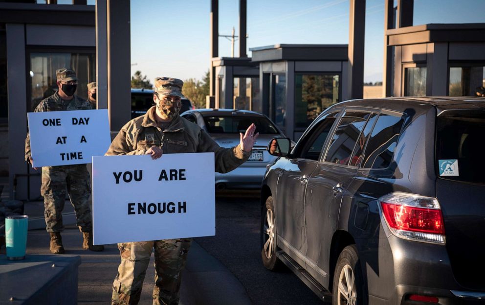 PHOTO: Master Sgt. Erin Kirby-Guanill, greets members at the Schriever North gate, Sept. 29, 2020, at Schriever Air Force Base, Colorado to spread a positive message to members who entered the installation.