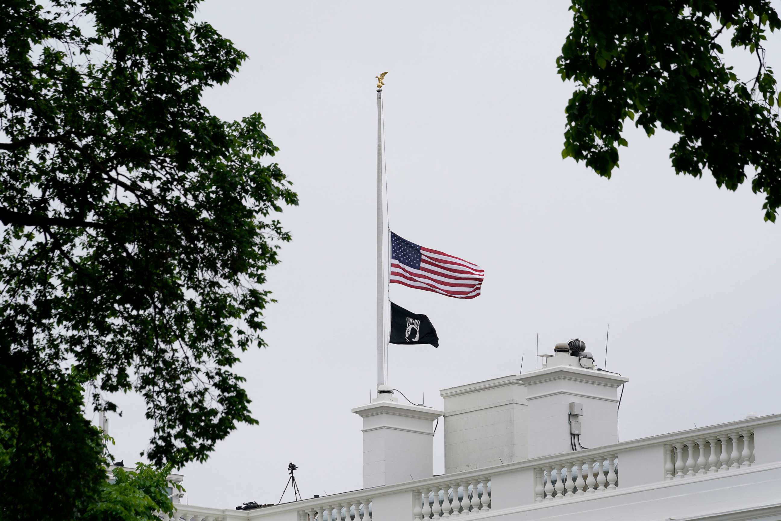 PHOTO: The American flag flies at half-staff at the White House in Washington, D.C., May 12, 2022, as the Biden administration commemorates 1 million American lives lost due to COVID-19.