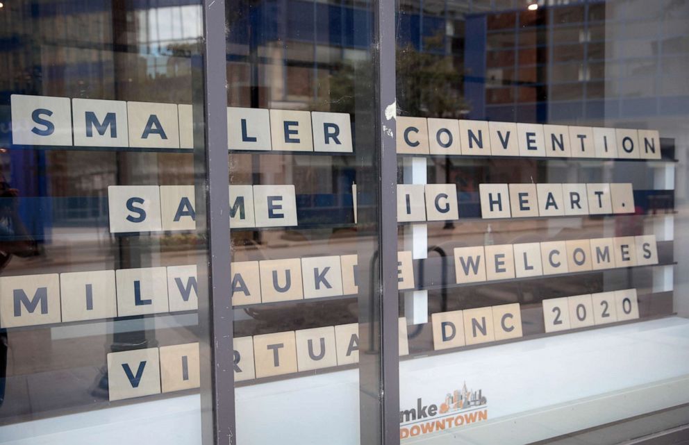 PHOTO: A sign in a storefront near the Wisconsin center welcomes visitors to the city on Aug. 17, 2020, the first day of the Democratic National Convention, in Milwaukee.