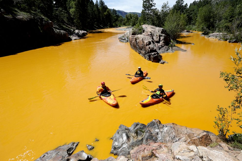 PHOTO: People kayak in the Animas River near Durango, Colo., in water colored from a mine waste spill, Aug. 6, 2015.