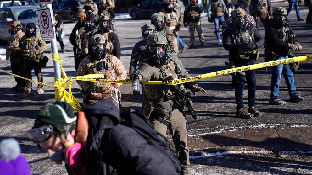 PHOTO: Federal immigration officers deploy pepper spray at protesters after a shooting on Jan. 24, 2026, in Minneapolis.