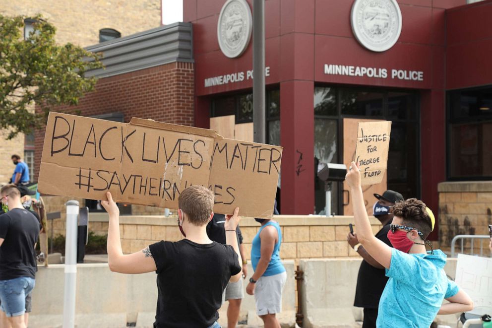 PHOTO: People protest outside the Minneapolis Police Department's 3rd Precinct over the arrest of George Floyd, who later died in police custody, in Minneapolis, May 27, 2020. 