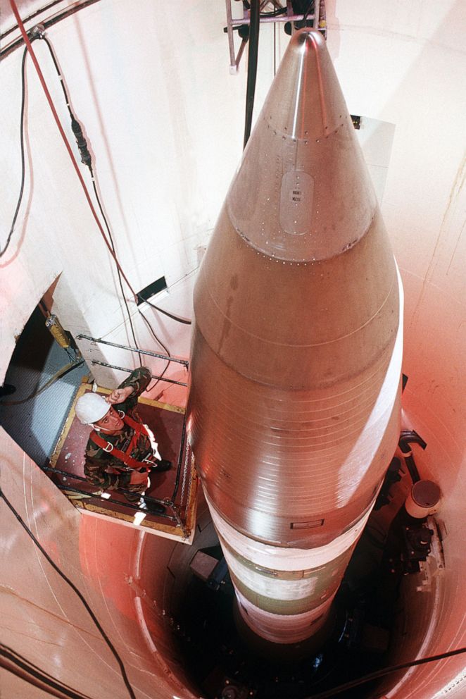 PHOTO: A maintainer looks over a Minuteman III in a silo about 60 miles from Grand Forks AFB, N.D., in 1989.