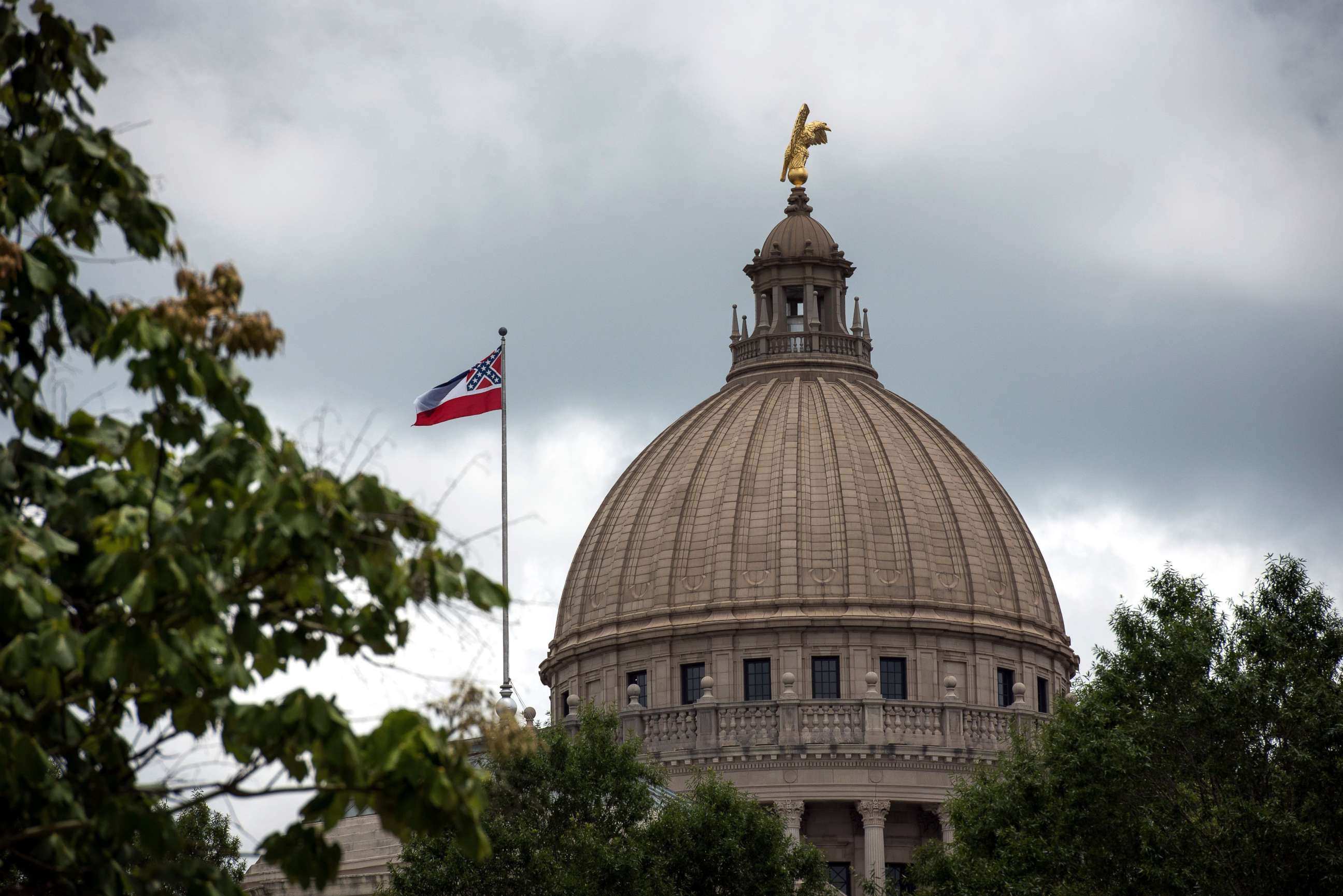 PHOTO: The state flag flies over the Mississippi State Capitol building in Jackson, Mississippi, June 29, 2020.